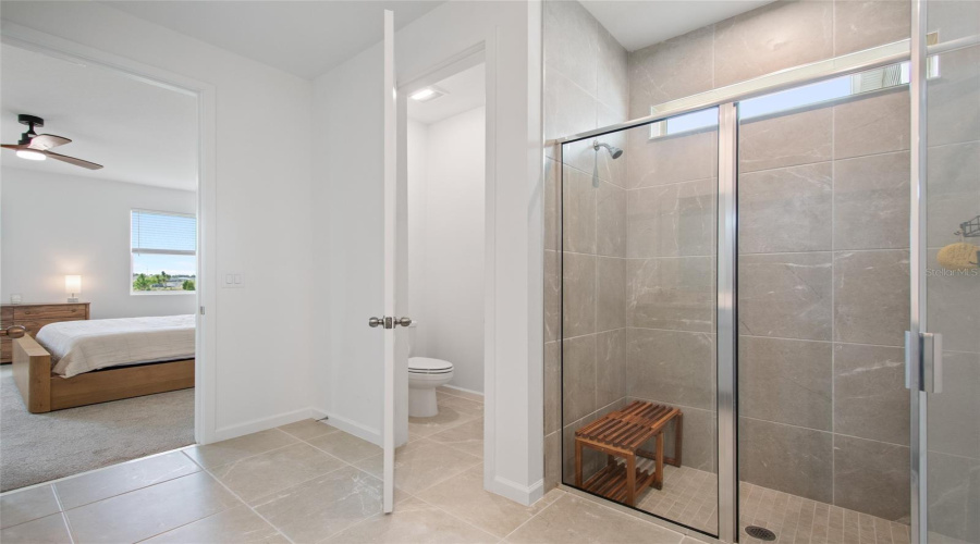 The Private Water Closet Is A Plus. Walk In Shower Easily Handles Your Favorite Shower Seat And The Tile Runs Floor To Ceiling And Has A Very Grand Feeling.