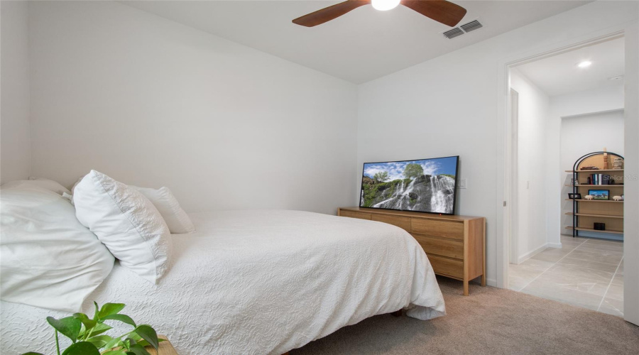 Bedroom 2 With View To Foyer Entrance.