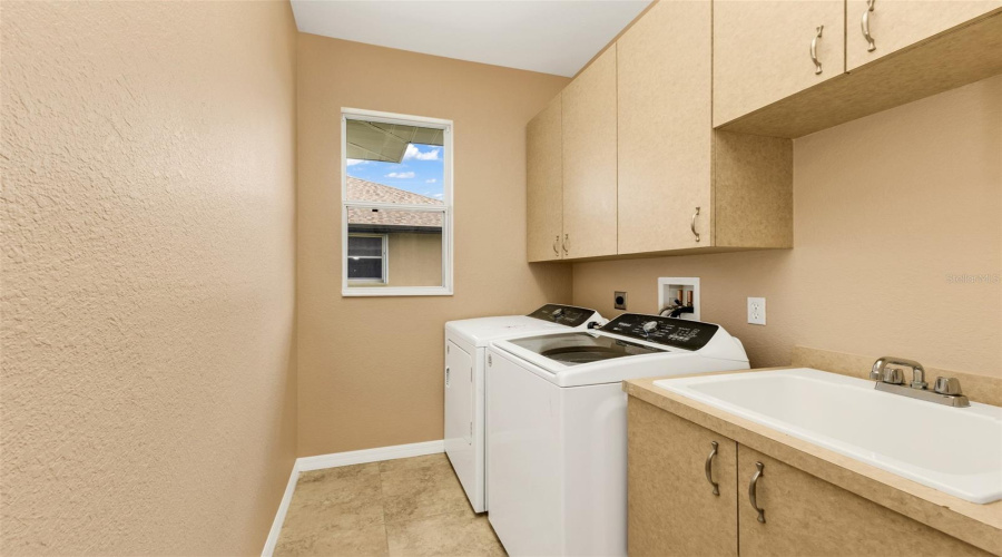 Laundry Room W Utility Sink And Cabinets