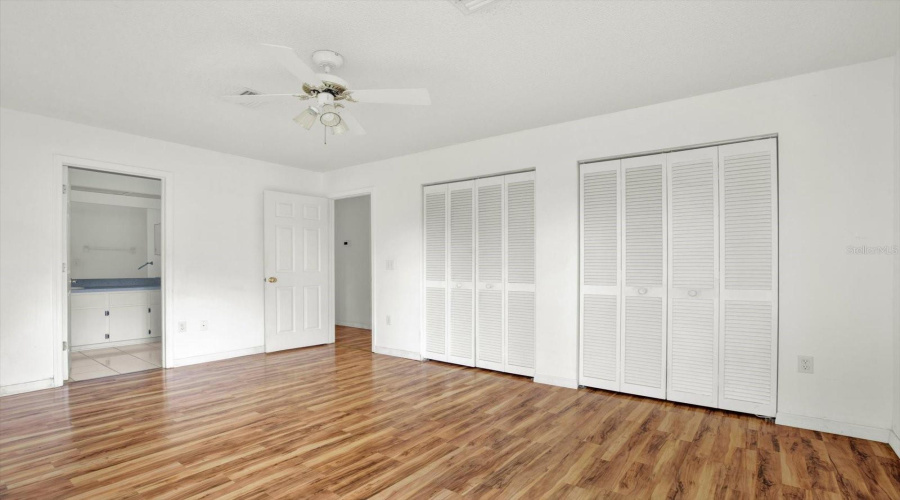 The Primary Bedroom, With Two Closets And Direct Access To The Ensuite Bath.