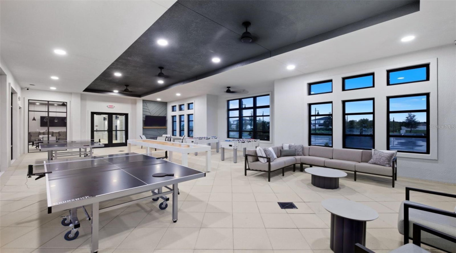 Bright Clubhouse Interior With Room For Events, Relaxing, And Neighborhood Gatherings.