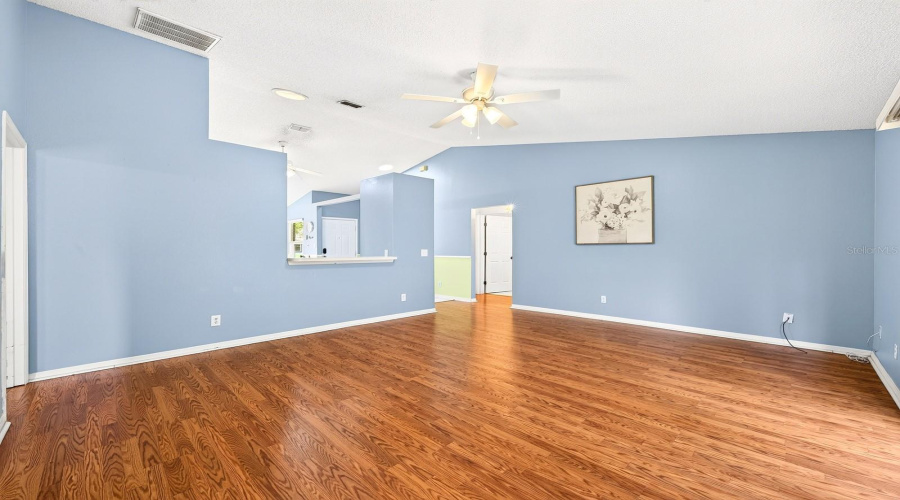 Beautiful Laminate Flooring Flows Through The Living Room.