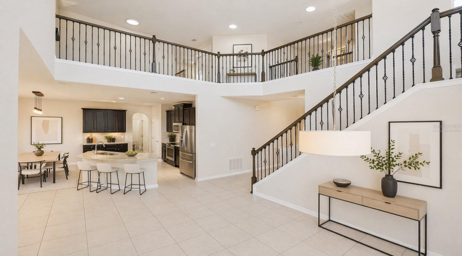 Virtually Staged Front Entrance With View Into The Kitchen