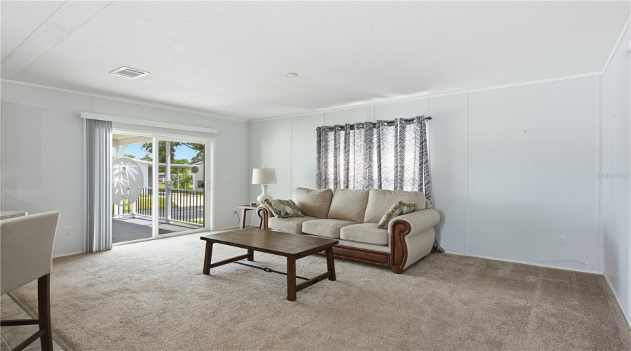 Living Room With Sliding Doors To Spacious, Covered Front Porch