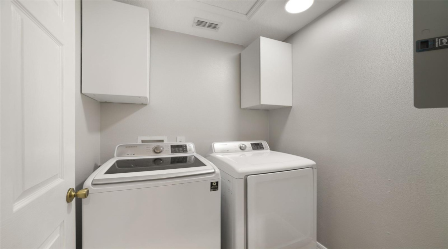 Just Off The Kitchen, The Dedicated Laundry Room Offers Additional Cabinetry And Includes The Washer &Amp; Dryer For Added Convenience.