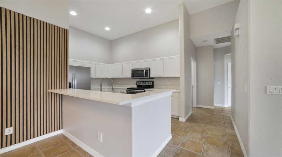 With Room For Counter-Height Stools, The Breakfast Bar Doubles As A Comfortable Spot For Quick Meals Or Gathering With Guests.