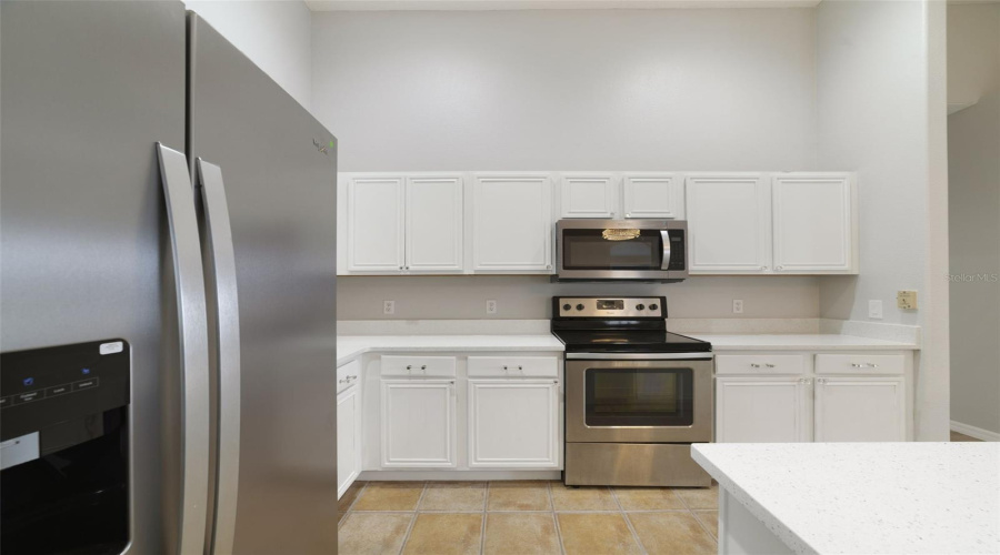 The Updated Kitchen Is Truly The Heart Of The Home, Featuring Abundant White Solid-Wood Cabinetry, Solid-Surface Countertops, Stainless Steel Appliances And A Convenient Breakfast Bar For Casual Meals Or Entertaining.