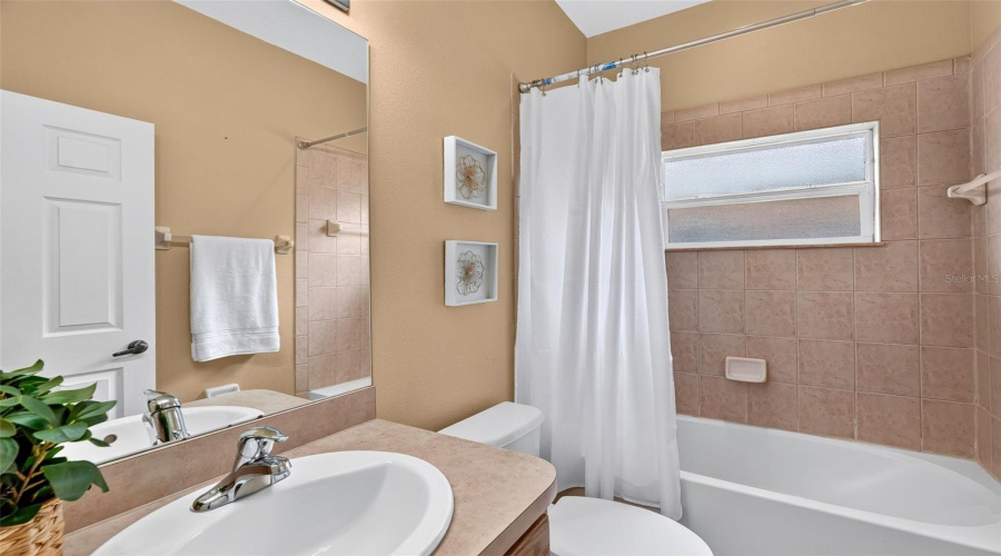 Two Bedrooms With Hall Bath Off Of The Kitchen.