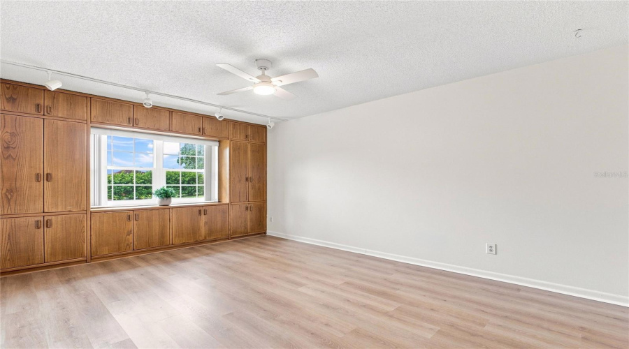 Oversized Hurricane-Impact Window Surrounded By Updated Cabinetry~