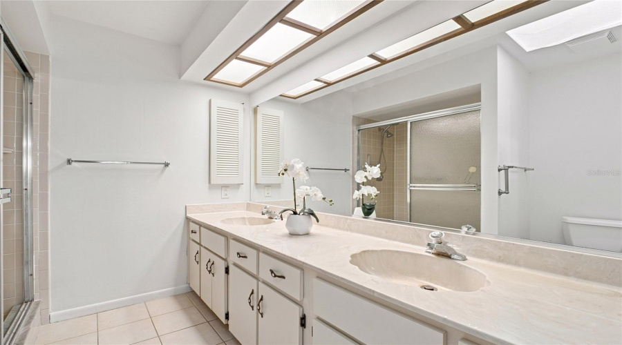 En-Suite Bath Features Dual Sinks, Abundant Cabinetry, And Walk-In Shower~
