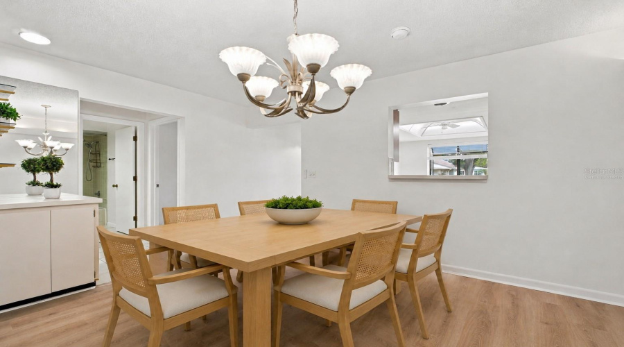 Virtually Staged: Dining/Main Living Perfectly Situated Between The Two Spacious Bedrooms Creating The Highly Desirable Split Plan~