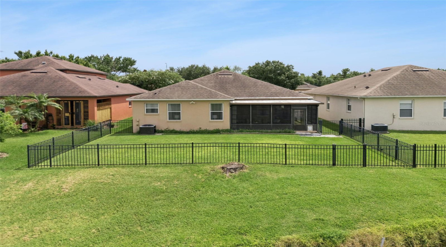 Fenced Yard And Pond Views.