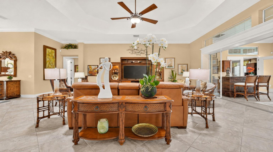 Overview Of Living Room Reflects Impressive 650 Square Footage Of This Area. Note The Console/Sofa Table (Behind The Natuzzi Leather Love Seat) That Has Carved Wood W/ Rattan-Front Drawers And A Scalloped Shelf Base. This Piece Was Manufactured By Broyhill As Part Of The &Quot;Tropical Retreat&Quot; Collection.