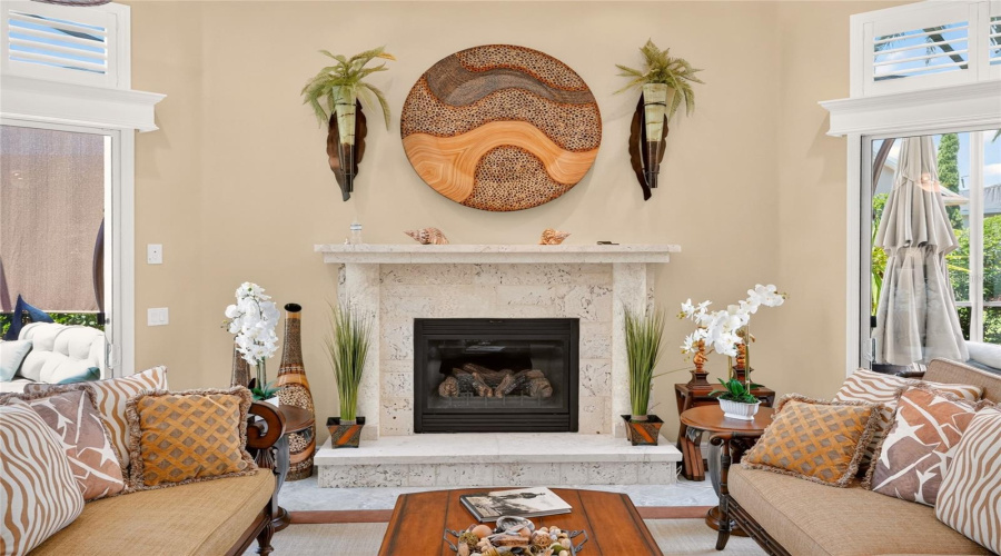 Close-Up View Of Fireplace (Gas) W/ Cut Coral Surround &Amp; Mantle Creates A Focal Point Between The Sliders, With Seating Arranged For Indoor/Outdoor Views.
