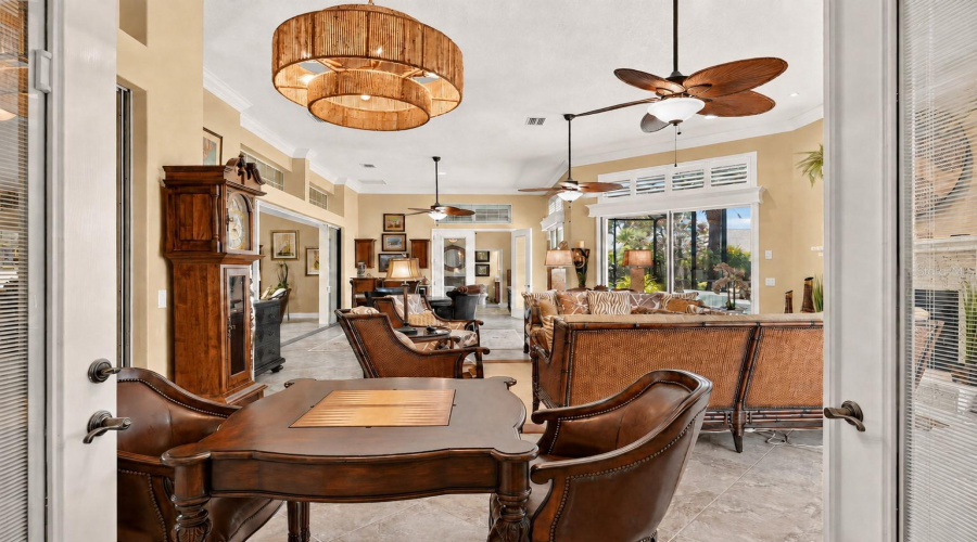 View Of Third Section Of The Gathering Room (Northern End) - Includes An Area To Play Competitive Backgammon. The Table And Two Chairs Are Manufactured By Frontgate. The French Doors W/ Built-In Blinds Shown In This Photo Lead To Primary Suite.