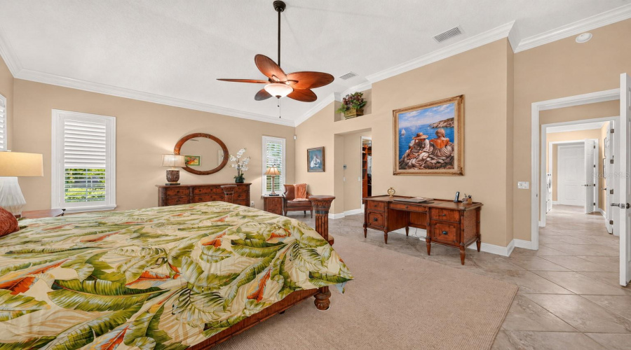 Another View Of Primary Suite From French Doors Leading To The North End Of Gathering Room - Shows The Spacious Bedroom Floorplan Offering Flexibility In Furniture Placement. Note Doorway (On Far R) Which Leads To The Interior Laundry (2 Doors) And Garage Access Door (White Closed Door).