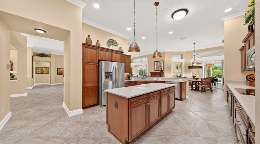 Hallway From Kitchen To Guest Wing (Entire L Side) Is Shown In This Photo - Formal Dining Room (Middle L), Foyer (Back L) Beyond Dr, And Expansive Living Room (R Side) &Amp; Archway W/ Decorative Plant Shelf Above Is Entrance To The Hallway On The Guest Wing.