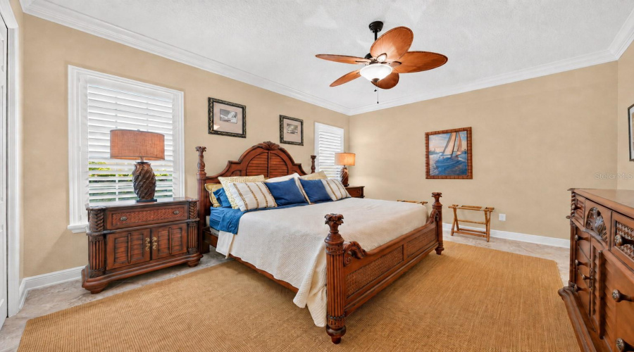 Bedroom #2 - View From Doorway Shows Crown Molding, Plantation Shutters, And Ceiling Fan. Note Bedroom Set Is Manufactured By Broyhill (Per Owner).