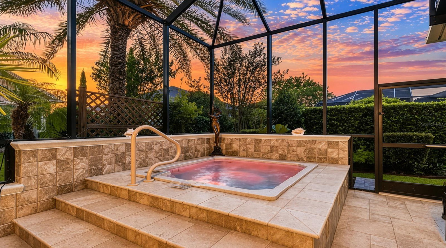 Spa Side Of Mansard Screen Enclosure At Dusk - Note That Custom Built-In Spa Has Changing Lights!