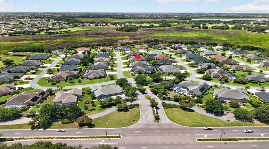 Aerial – Looking South – A Broad Preserve Along The Southern Edge Provides A Natural Privacy Buffer For This Private 53-Home Premier Neighborhood, With Lake Miona Visible In The Distance To The Right.