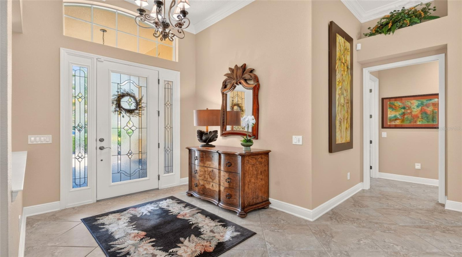 Another View Of The Foyer Shows The Entrance To The Hallway (L) Leading To Bedroom #3 (Front), Bedroom #2 (Middle), And Bathroom #2 In The Guest Wing. Note The Decorative Plant Shelf Above.