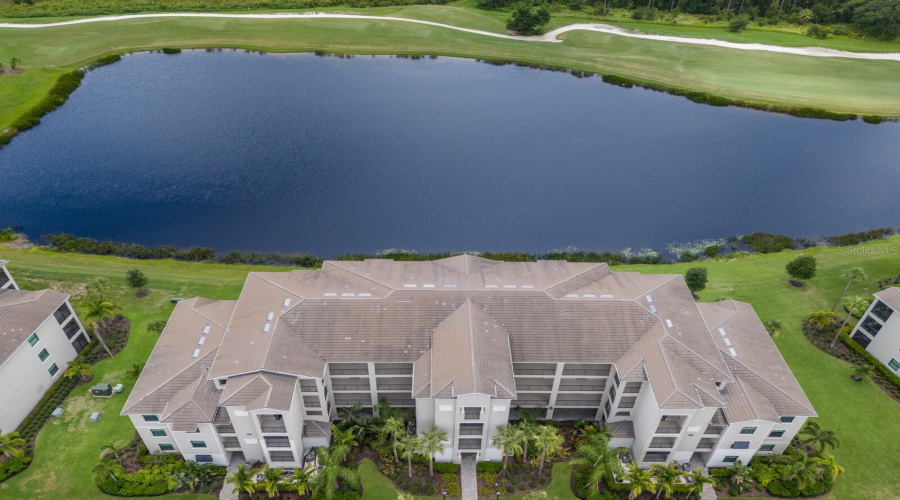 Aerial View Of Building With Wide Water View