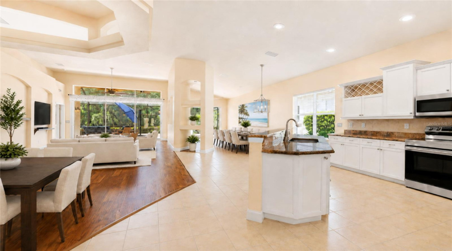 Virtually Staged Entry View Of Kitchen Dining/Living Room