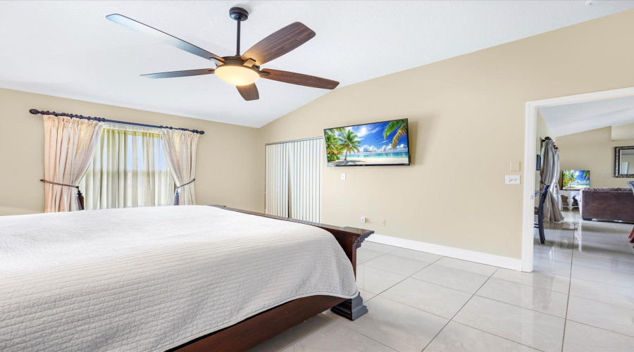 Primary Bedroom With Lighted Ceiling Fan
