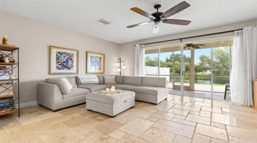 Living Room With Sliders To Screened In Lanai