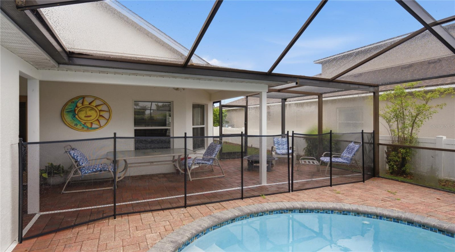 Screened And Pavered Freeform Pool