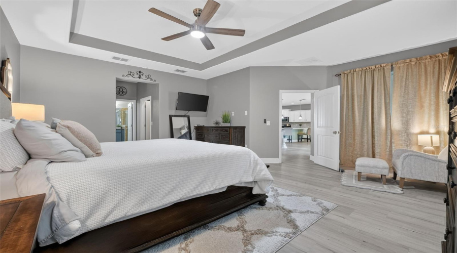 The Primary Bedroom Offers Its Own Entrance To The Screened Lanai. Ensuite Bath To Left.