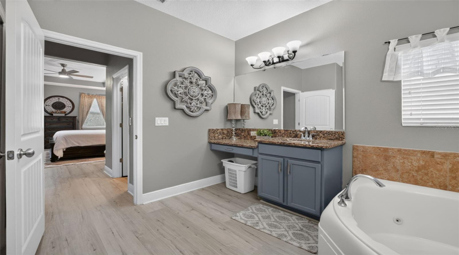 Ensuite Bathroom Towards Dual Walk-In Closet And Bedroom