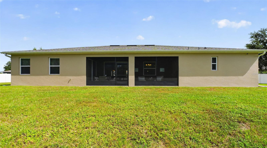 Backyard Facing The Spacious Screened Lanai, Great For Relaxing Outdoors