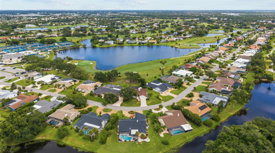 You Can See The Sports Club (Under Renovation) And Tennis Courts In The Left Of The Photos. This Home Is Conveniently Positioned 6 Houses Away From The Club Amenities!