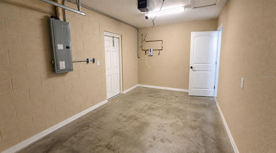 Garage W/ Side Man Door To Outside