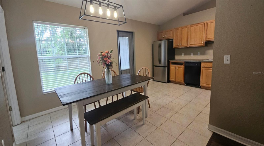 Open Kitchen With Large Dining Room Table