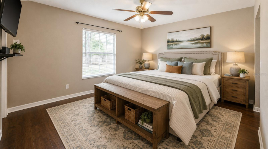 Staged - Large Primary Bedroom With Wood Looking Floors