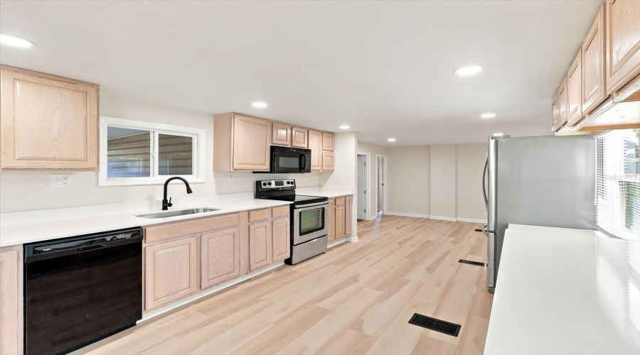 Galley Kitchen W/ White Quartz Countertops