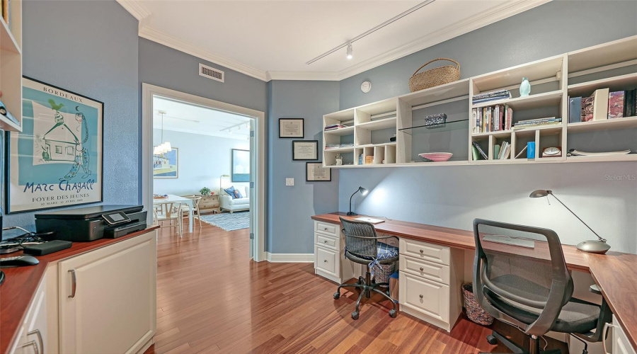 Office With Custom Shelving And Cabinetry