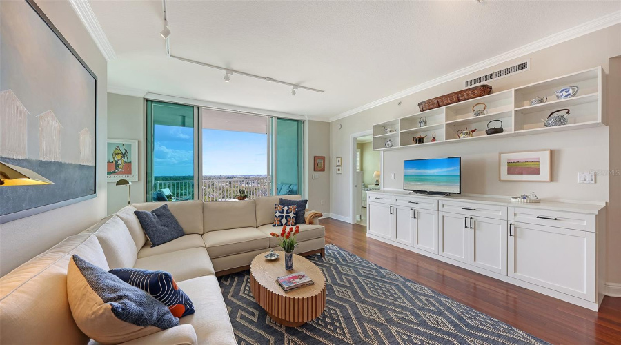 Living Room With Ceiling Height Wall Of Sliders