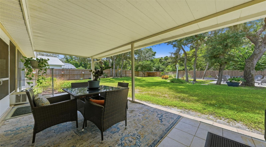 Open Patio With Terrific View Of The Backyard With Firepit