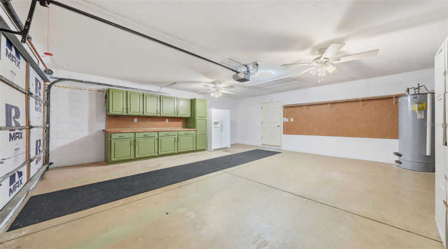 Garage Storage With Peg Board And Two Ceiling Fans