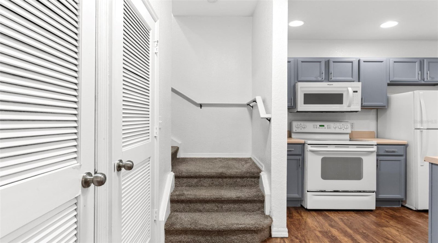 Stairs To Additional Bedrooms And Kitchen View