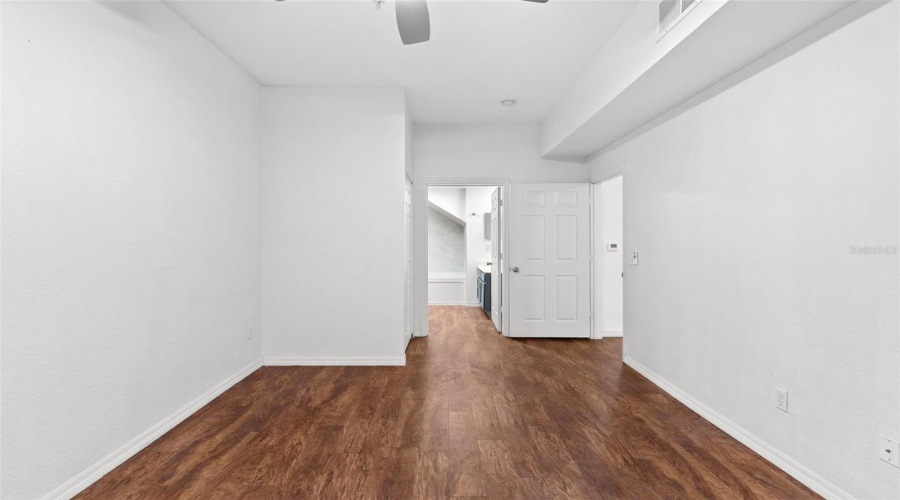 Additional View Of Primary Bedroom And Ensuite Bathroom Entrance
