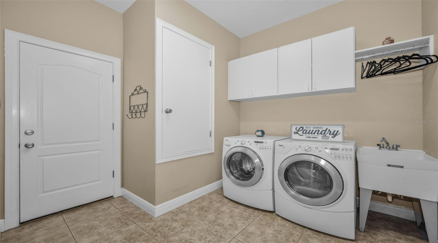 Indoor Laundry Room With Mud Sink And Cabinets