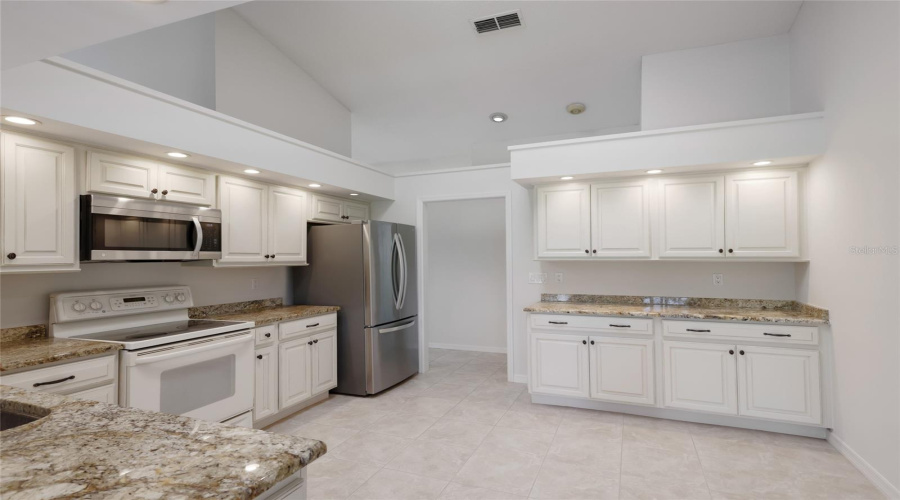 Updated Kitchen With Custom Wood Cabinetry. Cathedral Ceilings And Skylights Throughout The House.