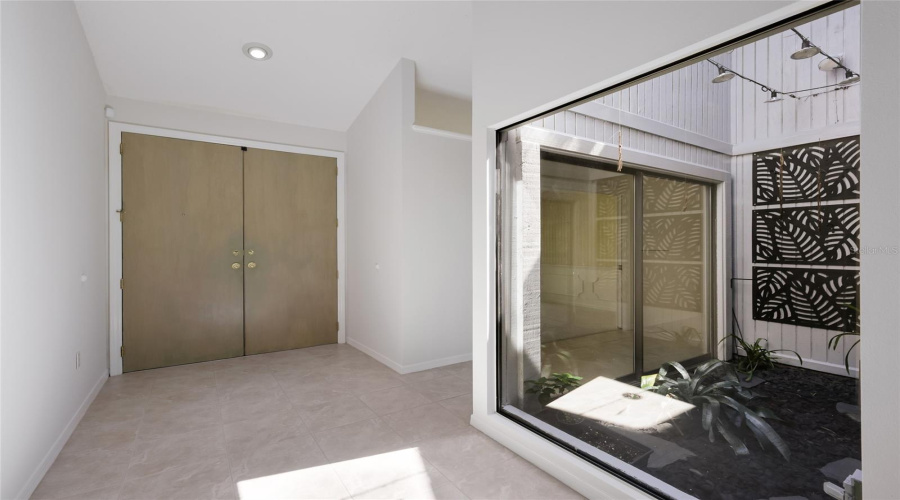 View Of Front Doors With Atrium.