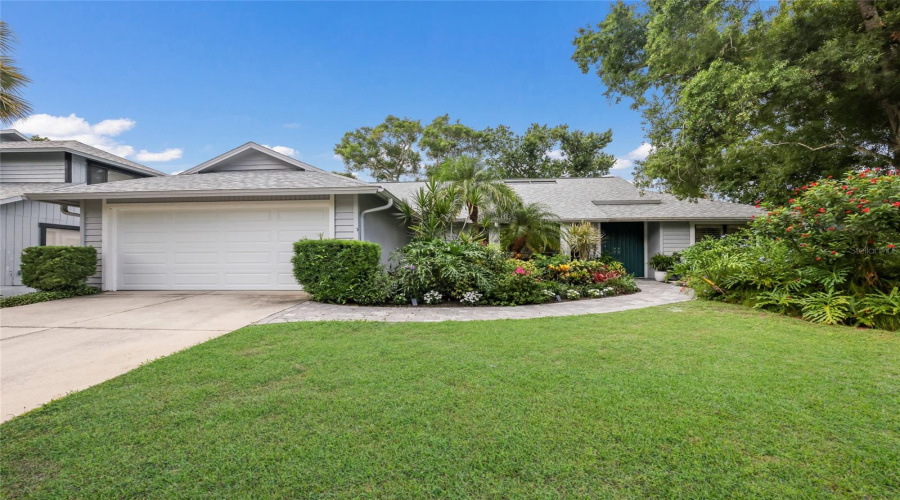 One Story Beautifully Landscaped Single Family Home.