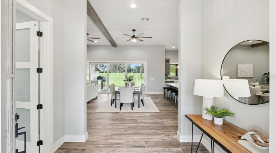 Welcoming Foyer With Luxury Tile Flooring Throughout