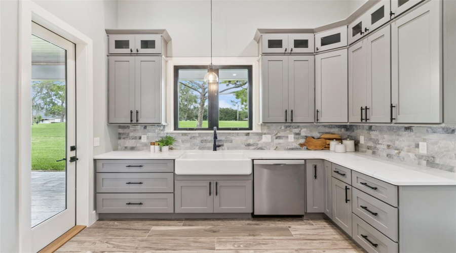 Custom Kitchen With Farmhouse Sink And Designer Finishes